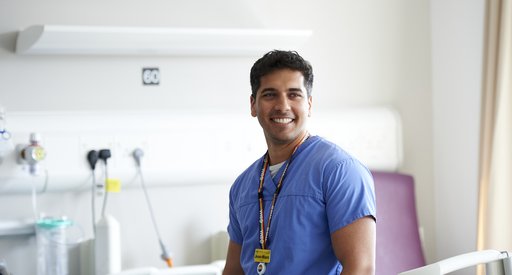 An image of a nurse in uniform working at a hospital.