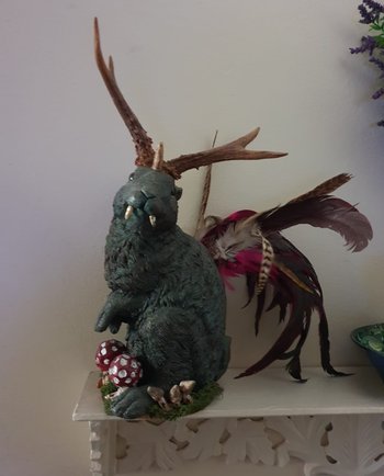 A wolpertinger - a creature from German folklore with the body of a rabbit, wings, antlers and fangs.